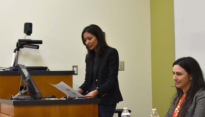 Dr. Parama Sarkar at a podium