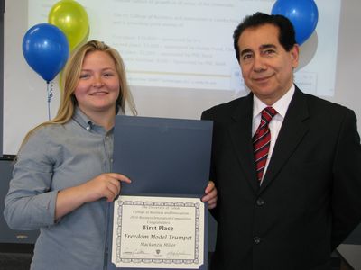 The first place winner Mackenzie Miller and Dr. Sonny Ariss, Chairman of the Department of Management, COBI
