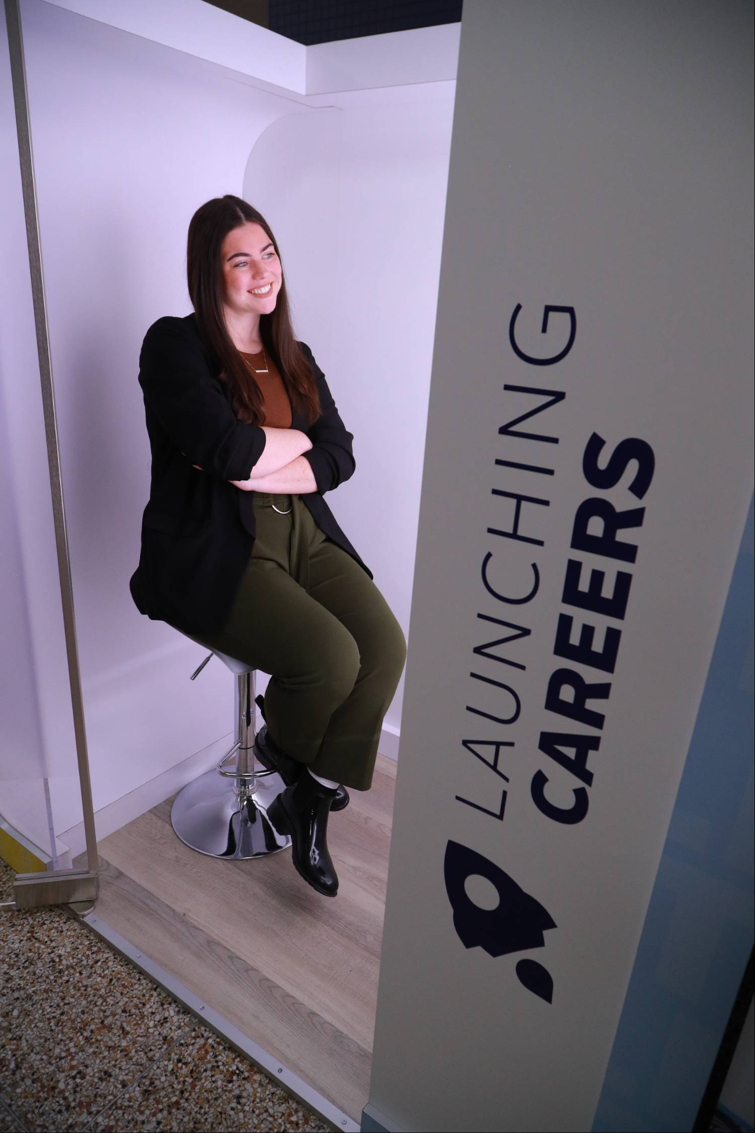 Anna Redd, communication studies major, poses for headshot in the professional headshot booth.