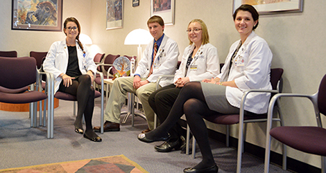 students sitting in hallway