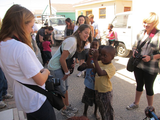 Students interacting with children