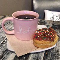 Coffee and a doughnut at Brew Coffee shop