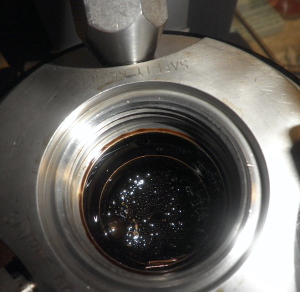 black oily liquid with hydrates inside pressure rheometer cell