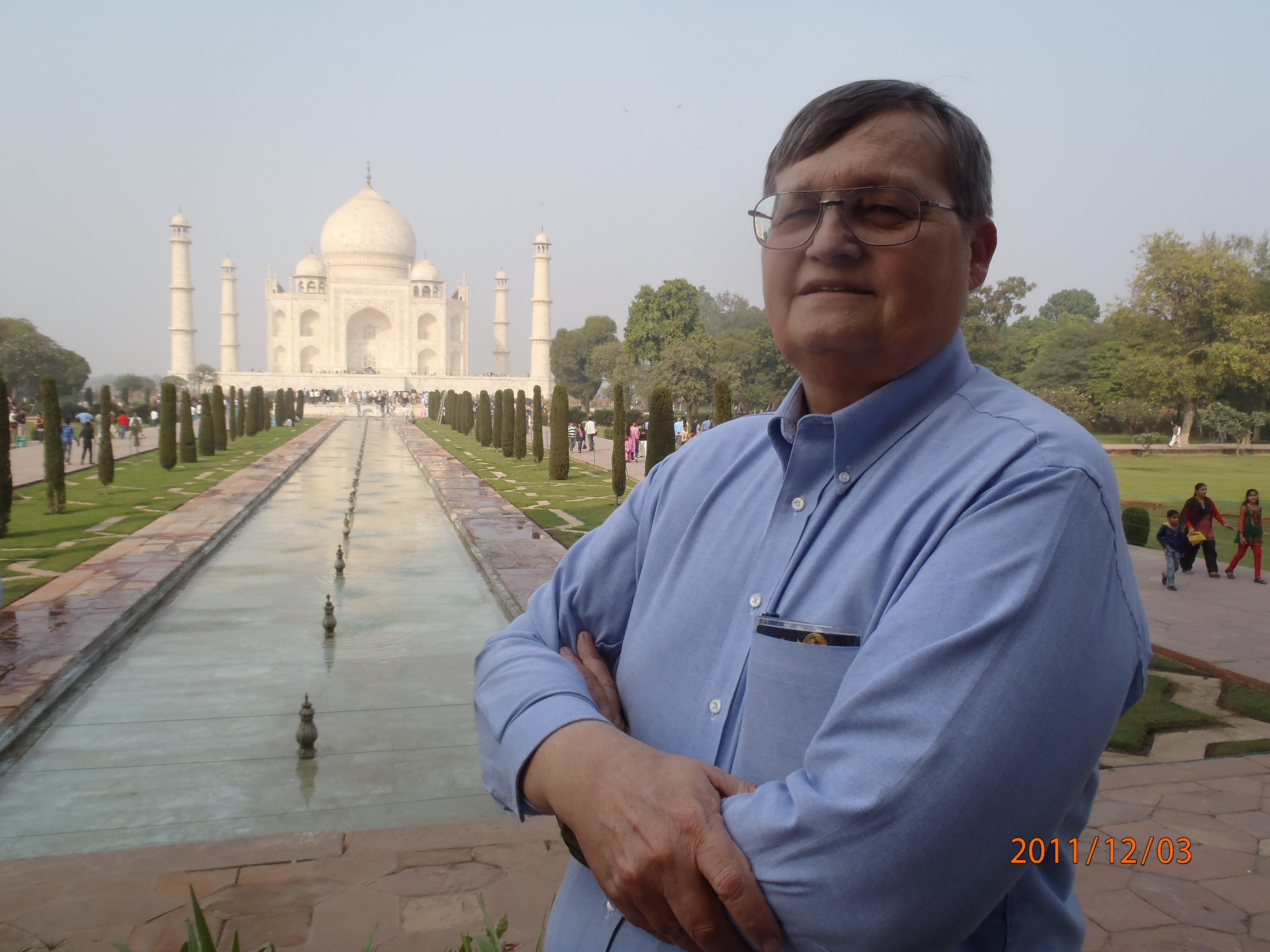 Walt Olson standing with Taj Mahal in background
