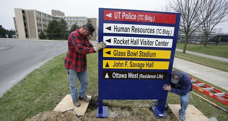 Workers Replacing Outdoor Signage