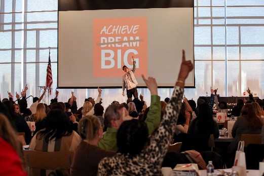 Achieve big presentation with presenter on stage and audience pointing up