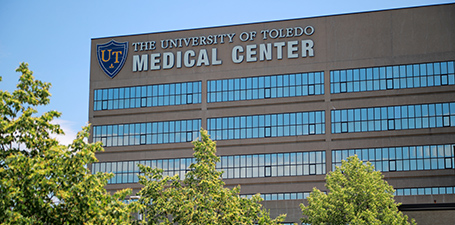 building with a big sign displaing the university of toledo medical center on the health science campus