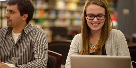 Picture of female student using computer in law library Picture of female student using computer in law library