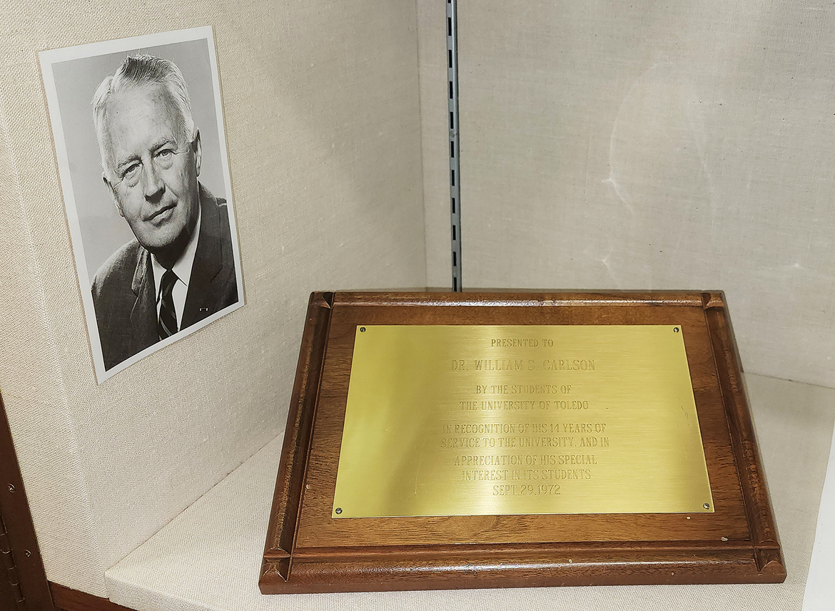Photo of Carlson in 1972 before retirement and a plaque