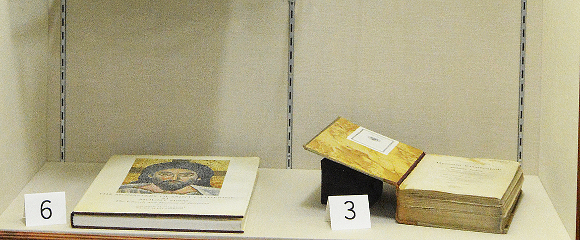 Bottom Shelf: 6) Forsyth, George H., and Kurt Weitzman. 1973. The Monastery of Saint Catherine at Mount Sinai: The Church and Fortress of Justinian.</em> University of Michigan Press.; 3) Dewey, Melvil. 1927. Decimal Clasification and Relativ Index for Libraries and Person Use in Arranging for Immediate Reference Books, Pamflets, Clippings, Pictures, Manuscript Notes and Other Material. Ed. 12., And enl.; Semi-Centennial ed. Forest Press