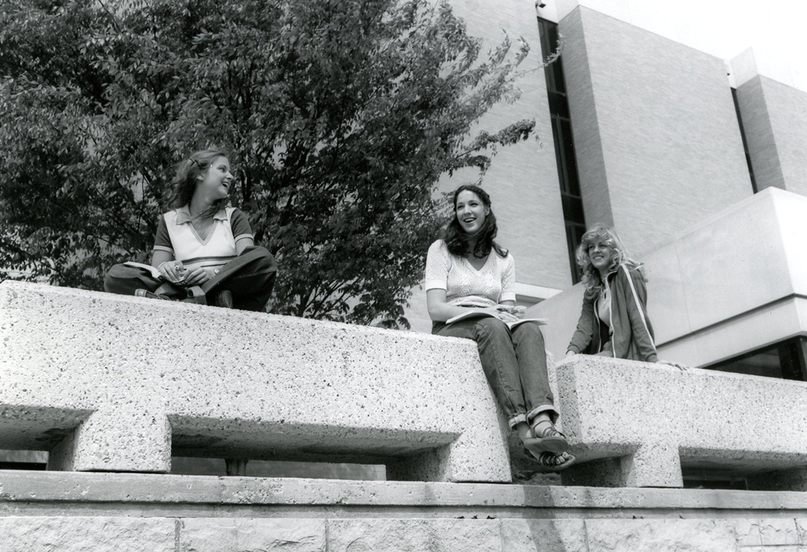 Students socializing outside Carlson Library