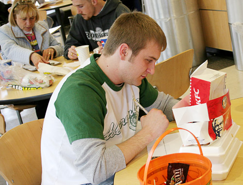 student in cafeteria eating kfc