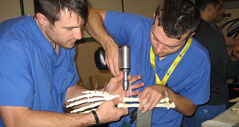 residents working on hand bone in lab