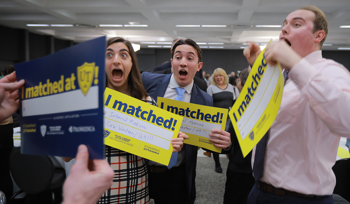Photo of Match Day 2024 celebrations featuring students with excited faces after a classmate reveals their match location.