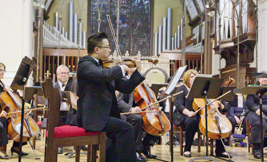 Student Robin Su performing in the World Doctors Orchestra USA.
