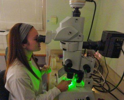Amanda looking in microscope