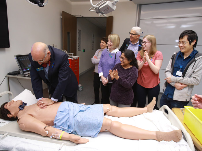 Faculty member demonstrating healthcare to students