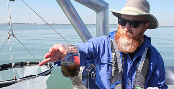 Dr. Tom Bridgeman showing water quality of Lake Erie