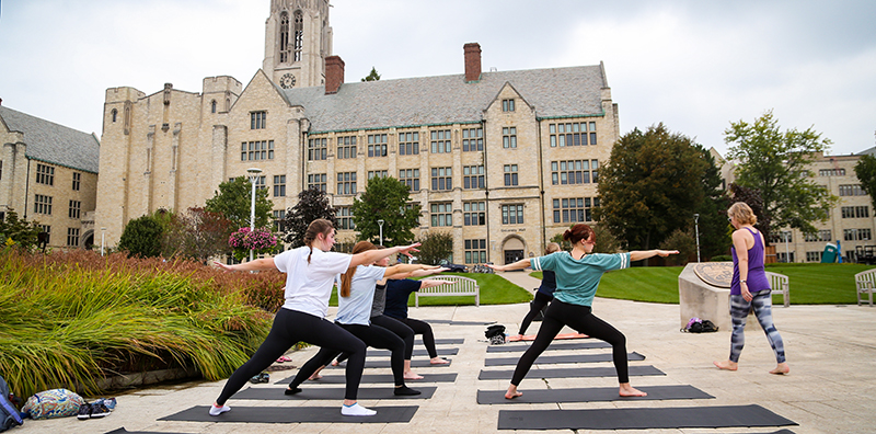 Students doing yoga at Centennial Mall
