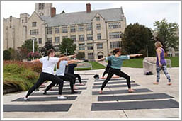 summer at UT, girls studying on bench