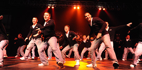 A group of students dancing on a stage