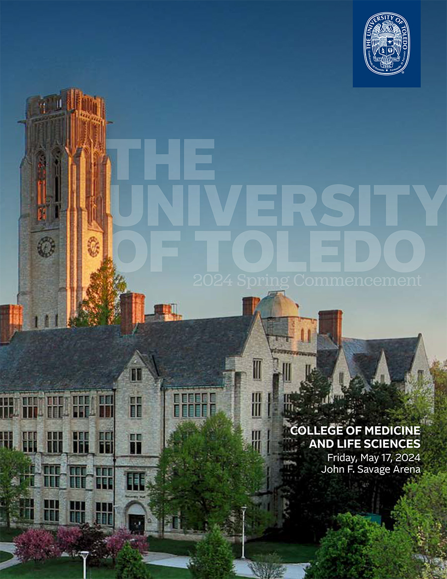 Commencement program cover featuring the University Hall clocktower on main campus