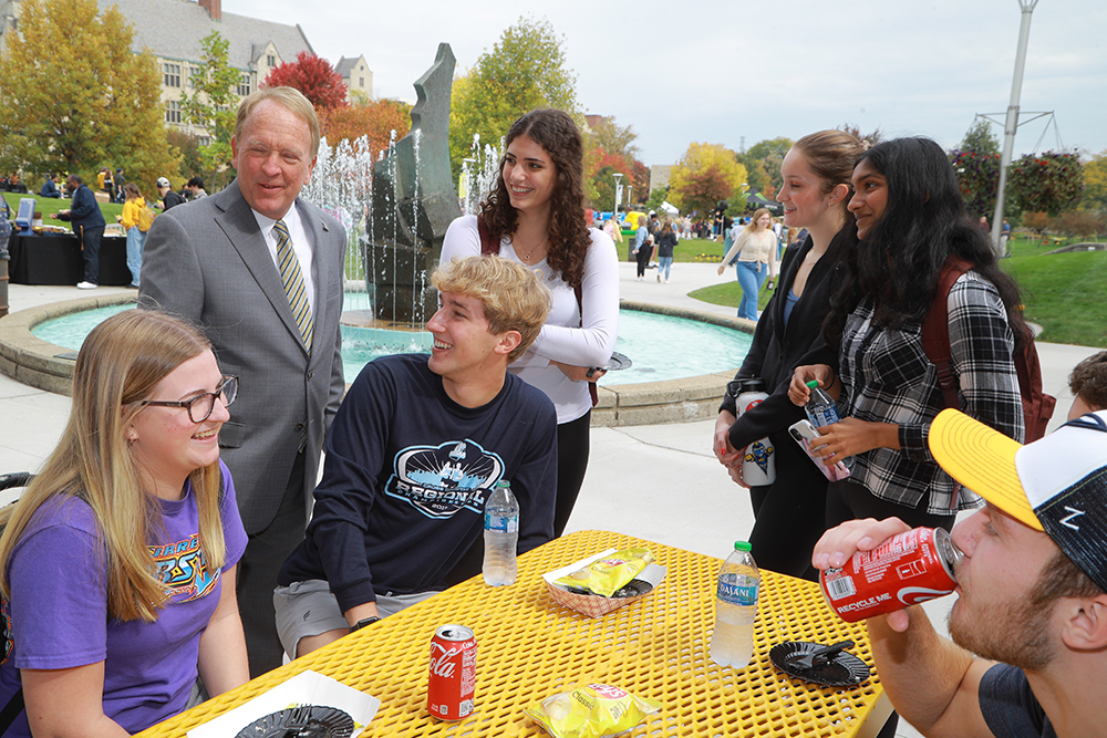 University of Toledo President Dr. Gregory Postel visits with students at the Founder's Day BBQ