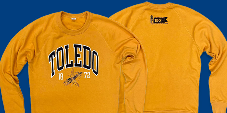 Gold sweatshirt with "Toledo" in vintage letters across the chest