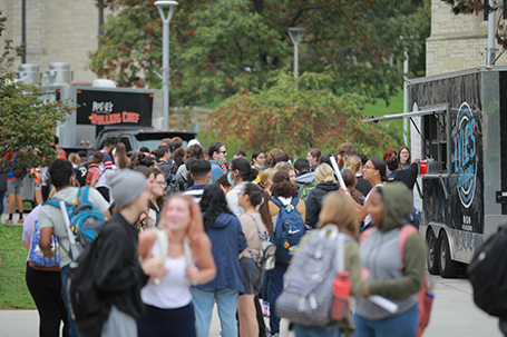 Students in line for food trucks on Main Campus