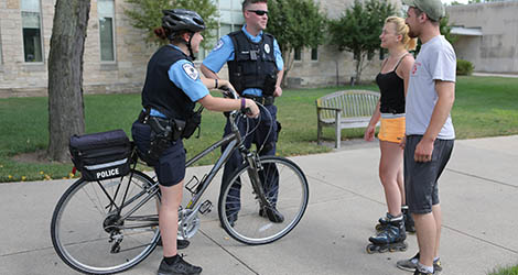 campus safety officers chatting with some students