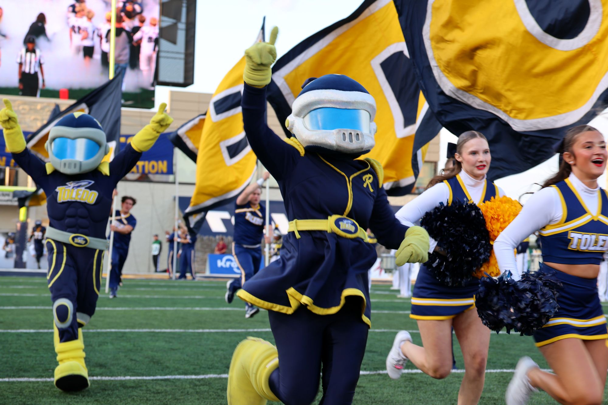 Rocksy mascot running onto football field