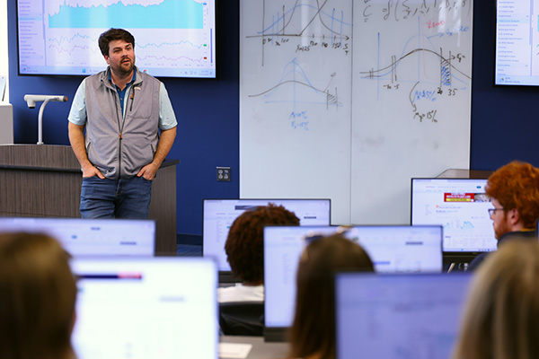 Professor presenting to classroom of business students