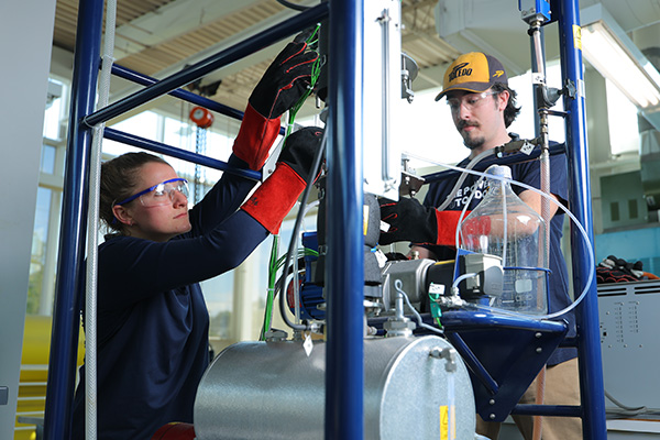 Engineering students working on a project