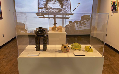 Carlson Library Art Showcase - display case in foreground with digital display in the background