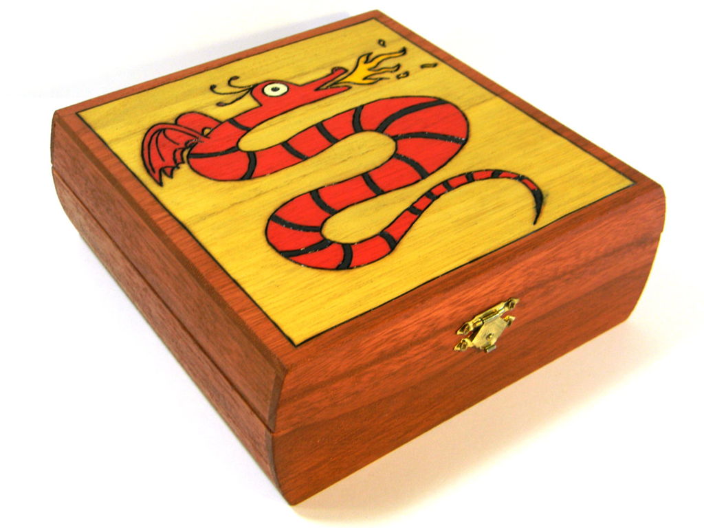 Photo of wooden box with the design of a dragon on the cover