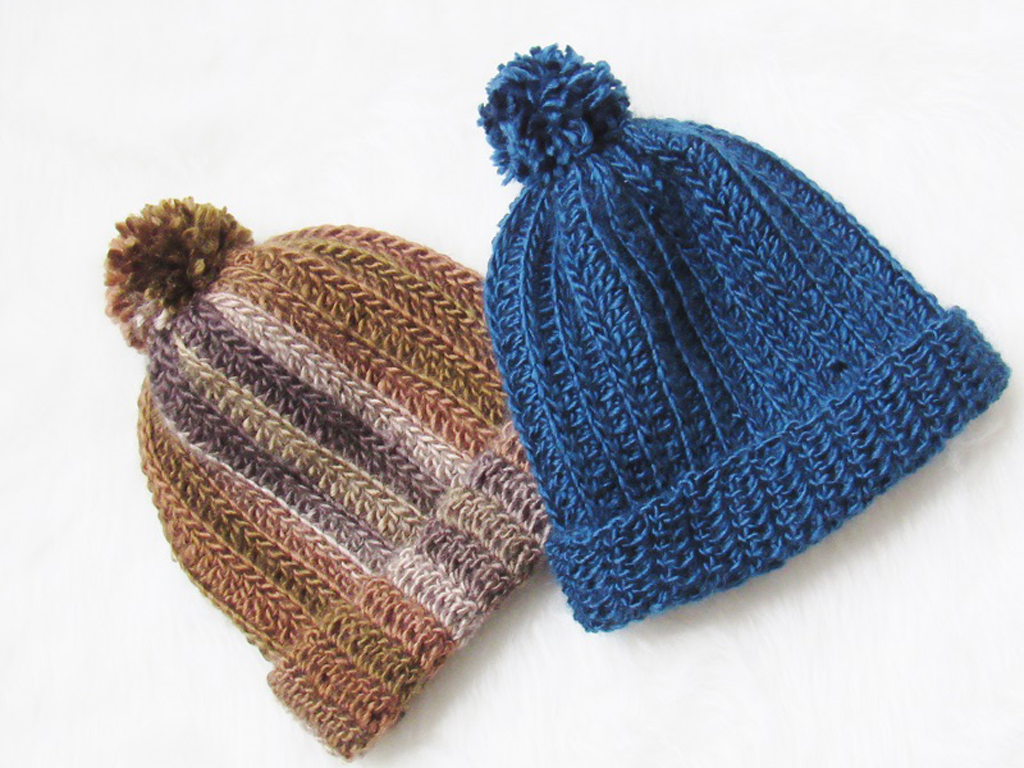 Photo of two kinitted or crocheted ski caps