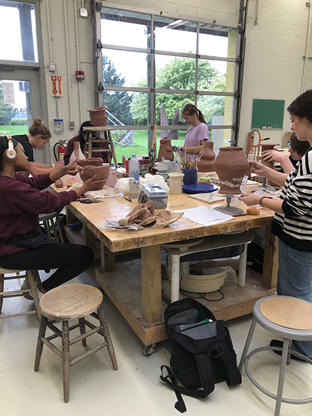 Students working on projects in the ceramics studio in the UToledo Center for Sculptural Studies