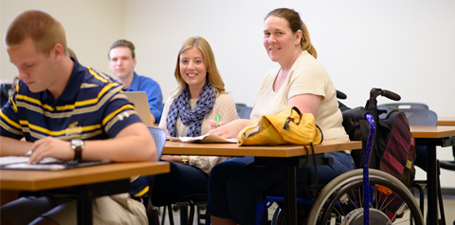 UToledo student using a wheelchair in class 