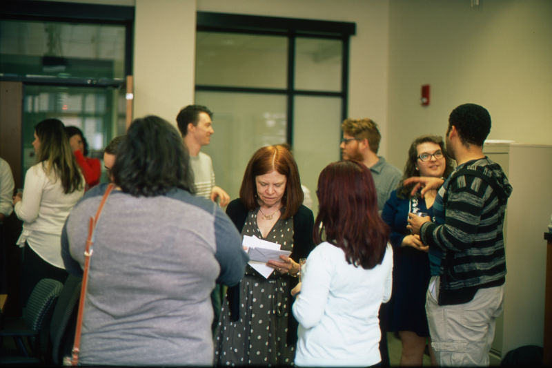 Dr. Sara Lundquist giving out congratulatory cards 