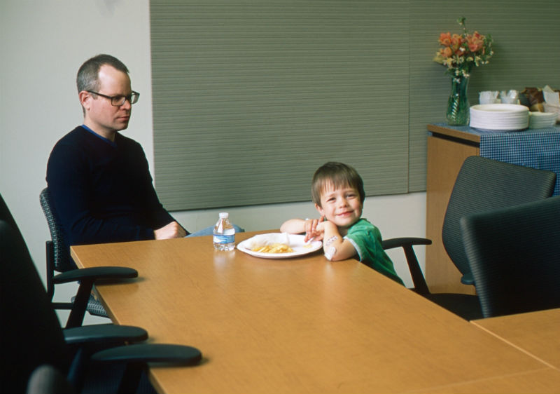 Dr. Stroud sitting with a child 