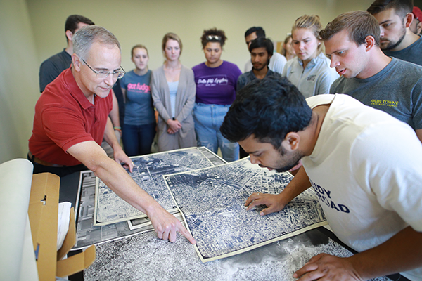 Geography and Planning students reviewing planning blueprints