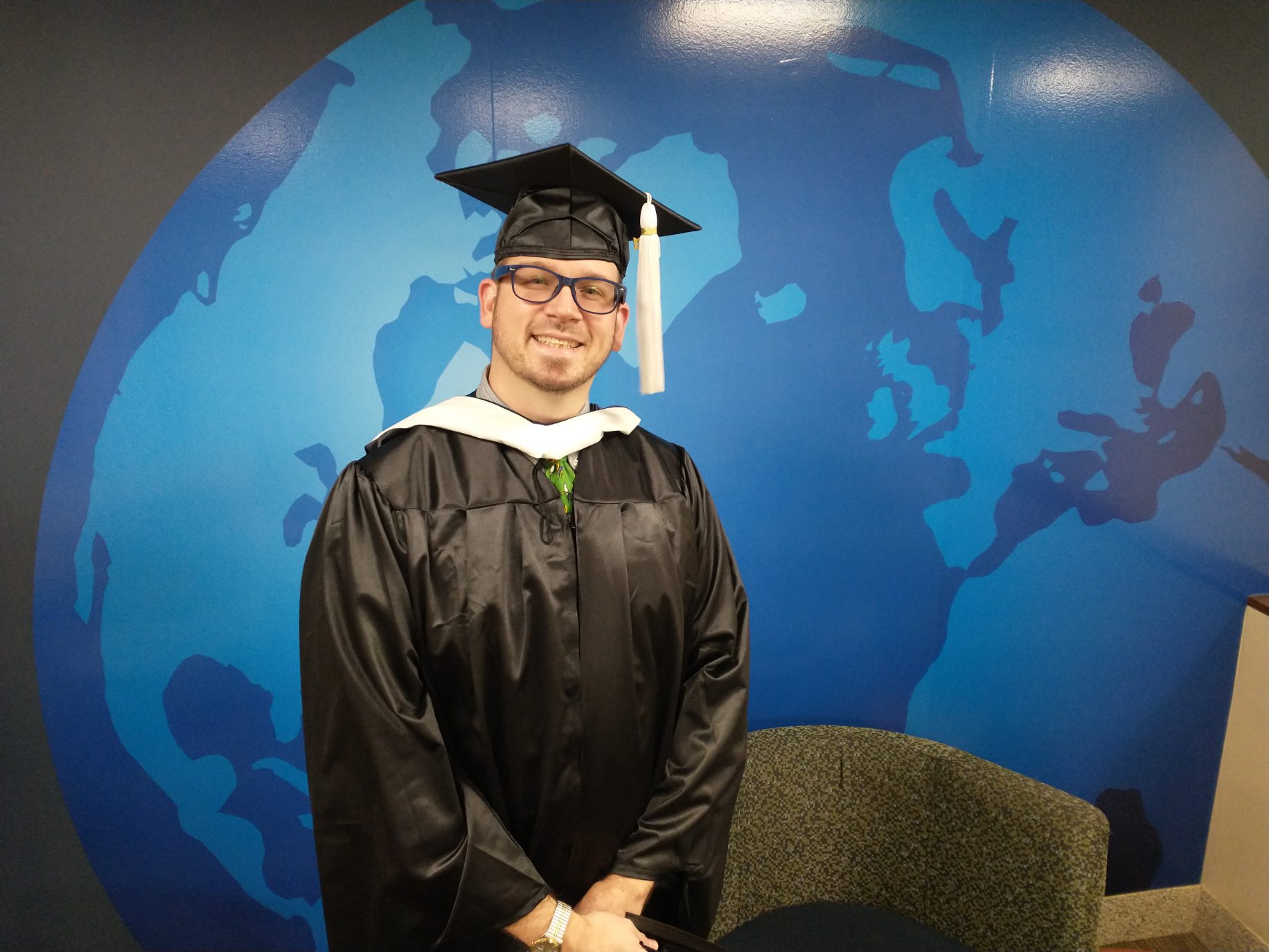 UToledo Geography and Planning student in cap and gown