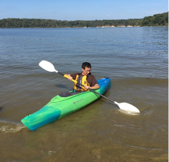 Dr. Minxuan Lan in a kayak. Dr. Lan is an assistant professor, Department of Geography and Planning, The University of Toledo,