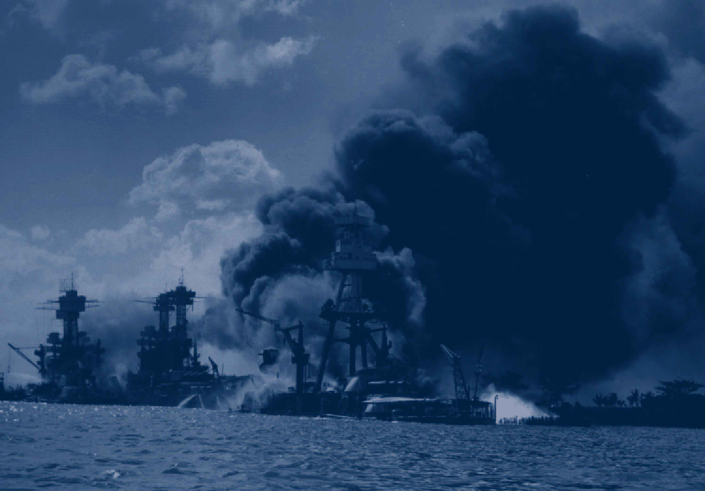 World War II battle at sea image with several ships afire