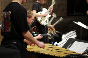 Percussion student playing with GuitArkestra ensemble
