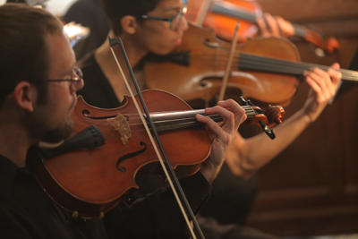 UToledo student musicians playing violins