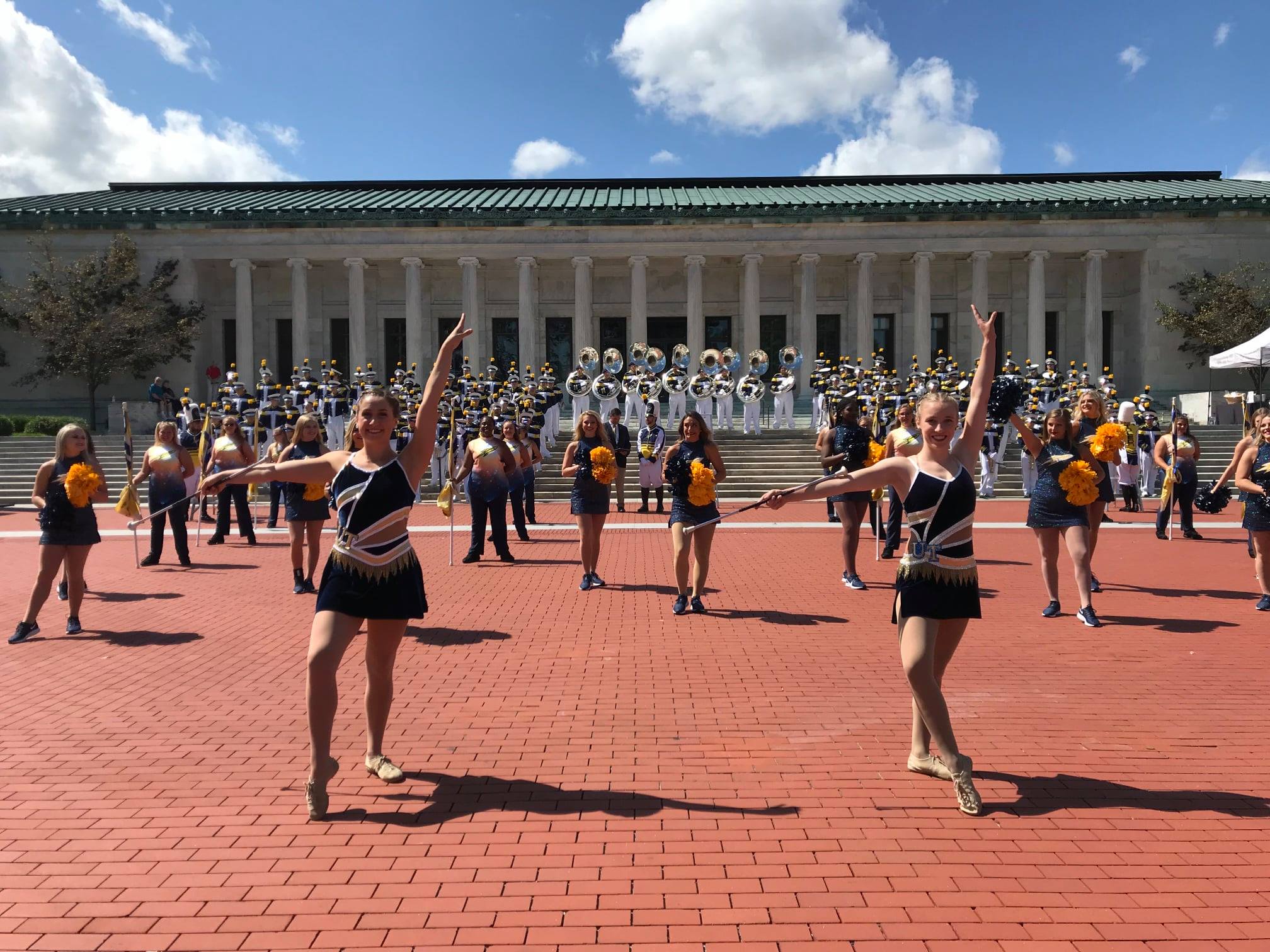 majorettes in front of a museum