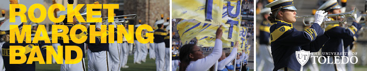 uniformed marching band members performing on a football field