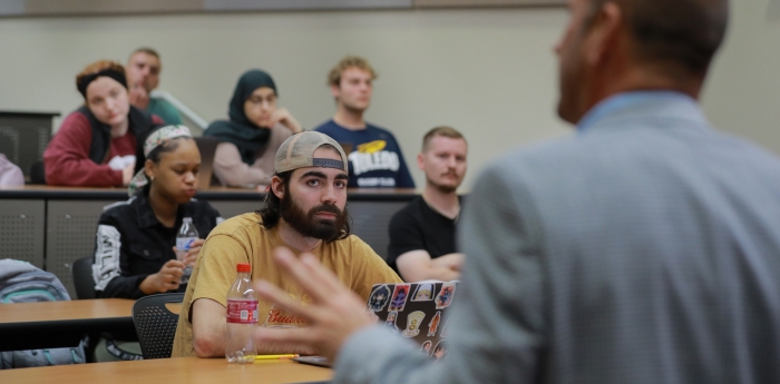 college of business students in a classroom listening to a lecture