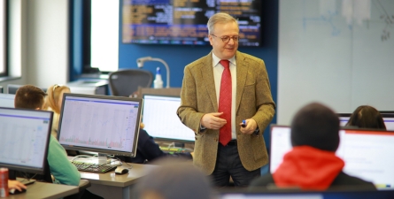 Dr. Ozcan Sezer teaches finance students within the Neff Trading Room on the campus of The University of Toledo.